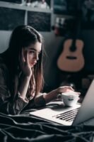 Photo by Elijah O'Donnell: https://www.pexels.com/photo/photo-of-woman-lying-on-bed-while-using-laptop-4066041/